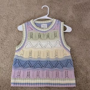 “Pink Rose” pastel sweater vest from Nordstrom.
